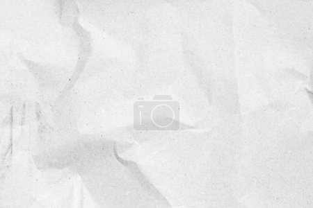 Foto de Papel blanco arrugado moderno sobre fondo gris hoja vacía con sombras de luz para papel pintado creativo, tarjeta, diseño de obra de arte
. - Imagen libre de derechos