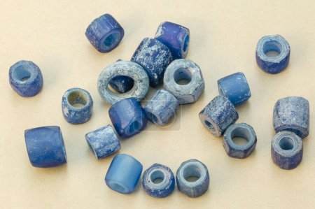 Photo for Anceint blue glass beads used as everyday items of adornment, ceremonial costumes and objects of barter (trade) from probably 1050 to 1250 AD. Northern Tuli Game Reserve. Botswana - Royalty Free Image