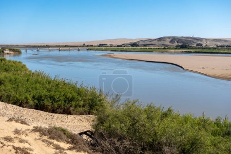Photo for View of the Orange River and the  Ernest Oppenheimer Bridge on the R382 road between South Africa and Namibia. Near Alexander Bay. Northern Cape. South Africa. - Royalty Free Image