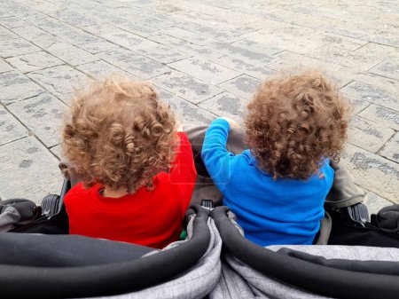 Photo for Twins in the stroller around the city - Royalty Free Image