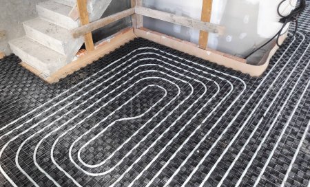 Radiant floor heating and cooling system