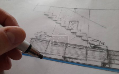 Foto de Architect designing a new staircase and new furniture with his pencil - Imagen libre de derechos
