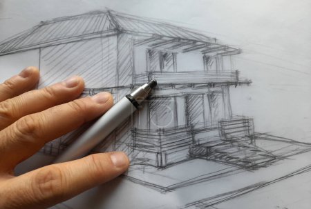 Foto de Architect planning a new house with his pencil - Imagen libre de derechos