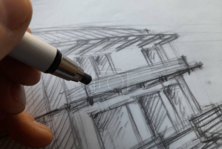 Foto de Architect planning a new house with his pencil - Imagen libre de derechos
