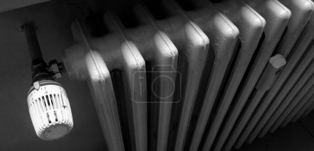 Photo for Thermostatic valve on the cast iron radiator of your home or office - Royalty Free Image