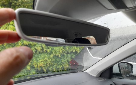 Driving in the rain in winter - rear view mirror