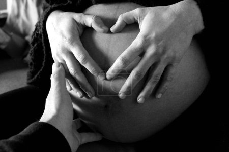 Pregnant woman waiting for her beloved child - heart