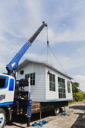 Crane lifting a knock down private house