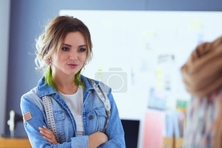 Photo for Fashion designer woman working on her designs in the studio. - Royalty Free Image