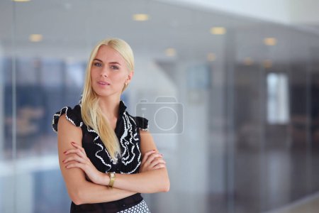 Photo for A beautiful blond business woman open the office door - Royalty Free Image