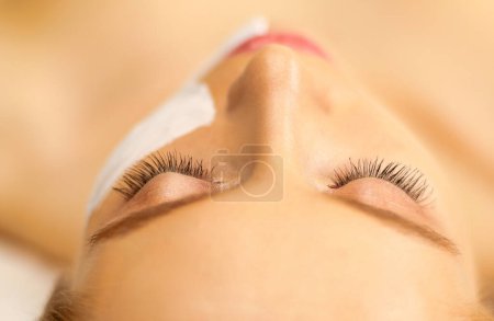 Photo for Spa facial mask application. Spa beauty organic facial mask application at day spa salon. - Royalty Free Image