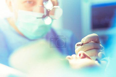Photo for Man surgeon at work in operating room. - Royalty Free Image