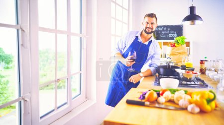 Photo for Portrait of handsome man filming cooking show or blog. - Royalty Free Image