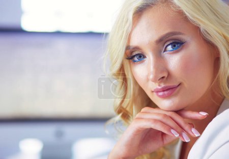 Photo for Beautiful young woman portrait , sitting in office - Royalty Free Image