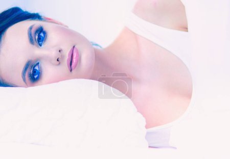 Photo for Young beautiful woman lying in bed - Royalty Free Image