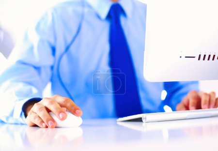 Photo for Businessman in the office on the phone with headset, Skype, FaceTime. - Royalty Free Image