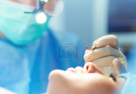Photo for Team surgeon at work in operating room. - Royalty Free Image