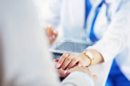 Photo for Female doctor giving a consultation to a patient and explaining medical informations and diagnosis. - Royalty Free Image