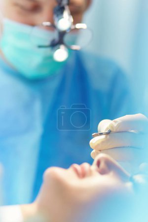 Photo for Man surgeon at work in operating room. - Royalty Free Image