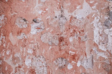 Photo for Detail of old pink wall refurbishing with scraps of removed plaster coating, grunge textured background - Royalty Free Image