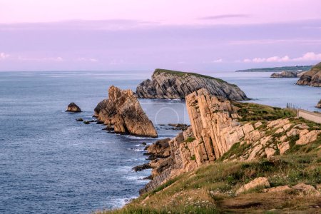 Photo for Beautiful coastal landscape at sunset along the Broken Coast of Liencres, Cantabria, Spain - Royalty Free Image