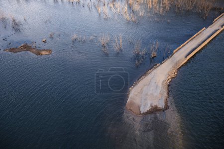 Photo for Detail of submerged old road visible due to a low water level of the Riano reservoir, Leon, Spain - Royalty Free Image