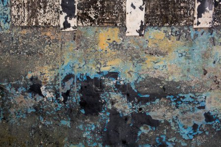 Photo for Detail of old metallic panel with scraps of flaking paint layers, grunge background - Royalty Free Image