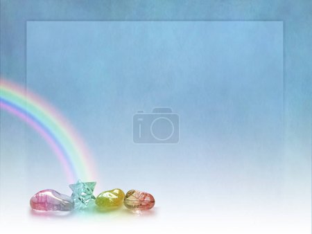 Photo for Colourful rainbow crystal blue template - contrasting rustic blue border frame background with a rainbow arc falling on a merkaba crystal and three polished stones ideal for a holistic crystal healing theme - Royalty Free Image
