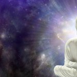 Meditating Chakra Buddha sitting in lotus position surrounded by  deep space - buddha on right side with seven chakras against a starry dark blue celestial sky with a massive nebula and copy space for text