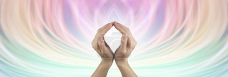 Colour energy healing therapist background message banner - hands making an O shape with white light behind against a flowing ethereal multicoloured background with copy space all around