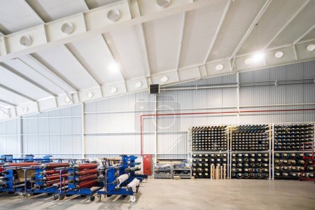 Big production warehouse with paper rolls and printing material