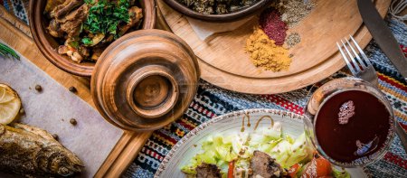 Photo for Arabic Cuisine: Middle Eastern traditional lunch. It's also Ramadan "Iftar". The meal eaten by Muslims after sunset during Ramadan. Assorted of Arabic oriental dishes. top view with close up. - Royalty Free Image