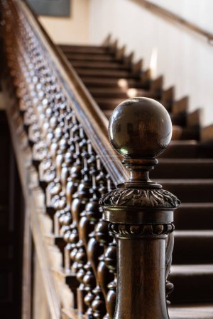 Wooden old decorative balusters Ancient wooden stairs. decorative railings carved from wood
