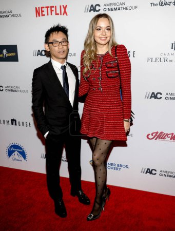 Photo for Los Angeles, CA  - Nov 17, 2022: James Wan and Ingrid Bisu  attend the  36th Annual American Cinematheque Awards Honoring Ryan Reynolds at The Beverly Hilton - Royalty Free Image