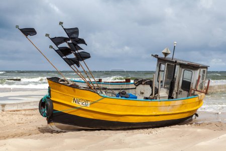 Photo for Fishing boat on the beach in Niechorz - Royalty Free Image