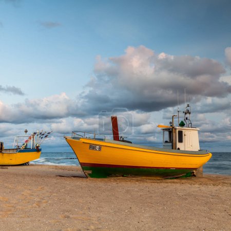 Foto de Fishing boat on the beach in Rewal circa August 2021 in Rewal. - Imagen libre de derechos