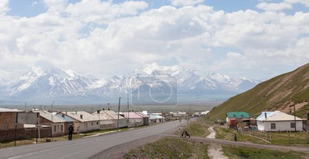 Photo for SARY-TASH, KYRGYZSTAN - CIRCA JUNE 2017: View on Sary-Tash a village and major crossroads in the Alay Valley of Osh Region, Kyrgyzstan circa June 2017 in Sary-Tash. - Royalty Free Image