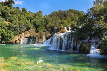 Photo for Immerse yourself in the tranquil embrace of Krka National Park, Split, as we capture the breathtaking beauty of cascading waterfalls. Let the soothing serenity of nature's masterpiece unfold before your eyes. - Royalty Free Image