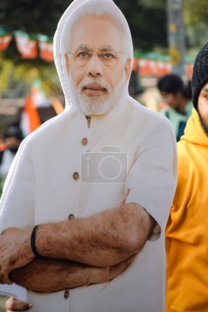 Téléchargez les photos : New Delhi, India - January 16 2023 - Prime Minister Narendra Modi cut out during BJP road show, the status of PM Modi while attending a big rally in the capital - en image libre de droit