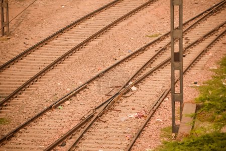 View of train Railway Tracks from the middle during daytime at Kathgodam railway station in India, Train railway track view, Indian Railway junction, Heavy industry