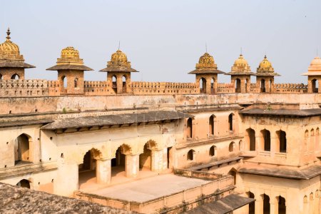 Beautiful view of Orchha Palace Fort, Raja Mahal and chaturbhuj temple from jahangir mahal, Orchha, Madhya Pradesh, Jahangir Mahal - Orchha Fort in Orchha, Madhya Pradesh, Indian archaeological sites Poster 707207524
