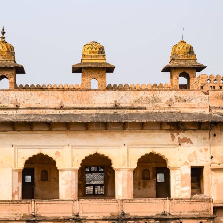 Beautiful view of Orchha Palace Fort, Raja Mahal and chaturbhuj temple from jahangir mahal, Orchha, Madhya Pradesh, Jahangir Mahal - Orchha Fort in Orchha, Madhya Pradesh, Indian archaeological sites Poster 707207614