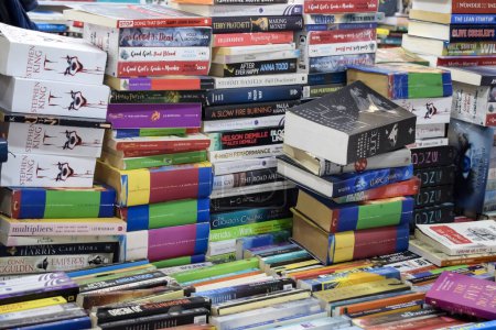 Photo for New Delhi, India, February 17 2024 - Variety of Books on shelf inside a book-stall at Delhi International Book Fair, Selection of books on display in Annual Book Fair at Bharat Mandapam complex - Royalty Free Image