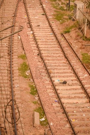 View of train Railway Tracks from the middle during daytime at Kathgodam railway station in India, Train railway track view, Indian Railway junction, Heavy industry