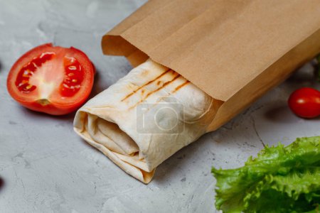 Photo for Shawarma sandwich gyro fresh roll of lavash pita bread chicken beef shawarma falafel RecipeTin Eatsfilled with grilled meat, mushrooms, cheese. Traditional Middle Eastern snack - Royalty Free Image