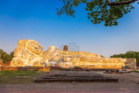 Photo for Large white reclining Buddha statue at Wat Lokayasutharam. Ayutthaya Historical Park, Thailand - Royalty Free Image