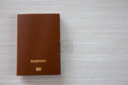 Photo for Passport for International travel and business laid out on a wooden background. Copy space background - Royalty Free Image