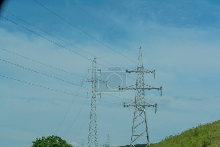 Photo for High voltage towers with sky background. Power line support with wires for electricity transmission. High voltage grid tower with wire cable at distribution station. Energy industry, energy saving. - Royalty Free Image