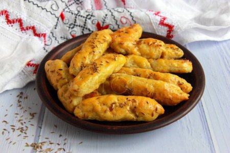 Homemade potato sticks with cumin seeds. Delicious appetizer and snack to borscht