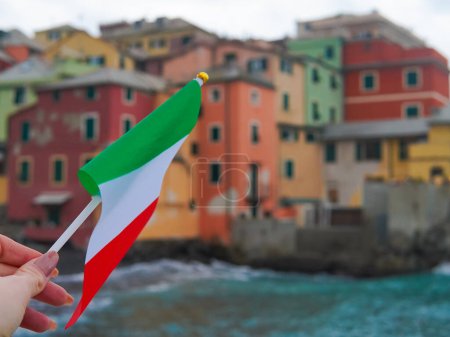 close up of tricolor national flag of Italy on seascape background